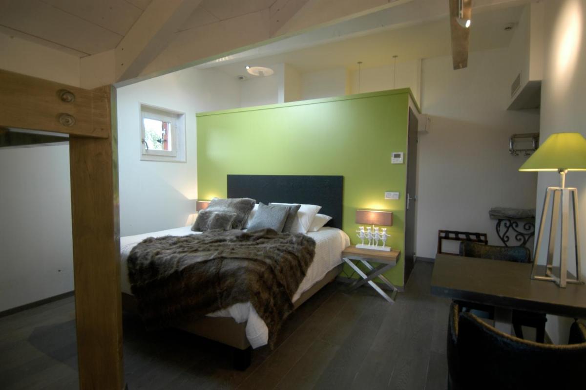 Un ou plusieurs lits dans un hébergement de l'établissement Auberge De Maison Rouge