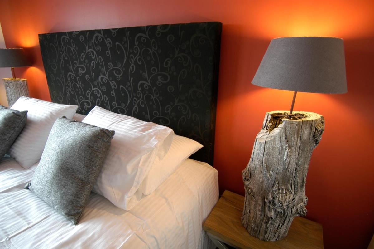Un ou plusieurs lits dans un hébergement de l'établissement Auberge De Maison Rouge