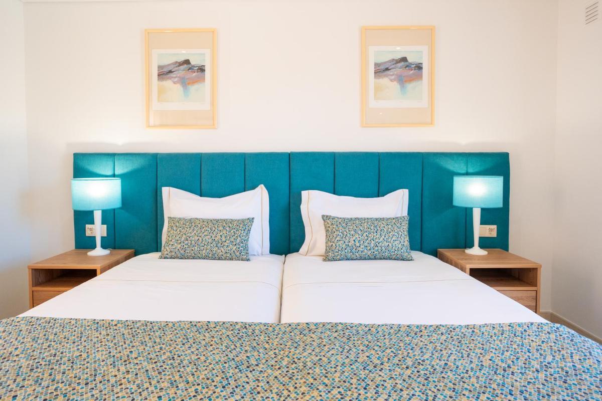 Uma cama ou camas num quarto em Four Seasons Vilamoura