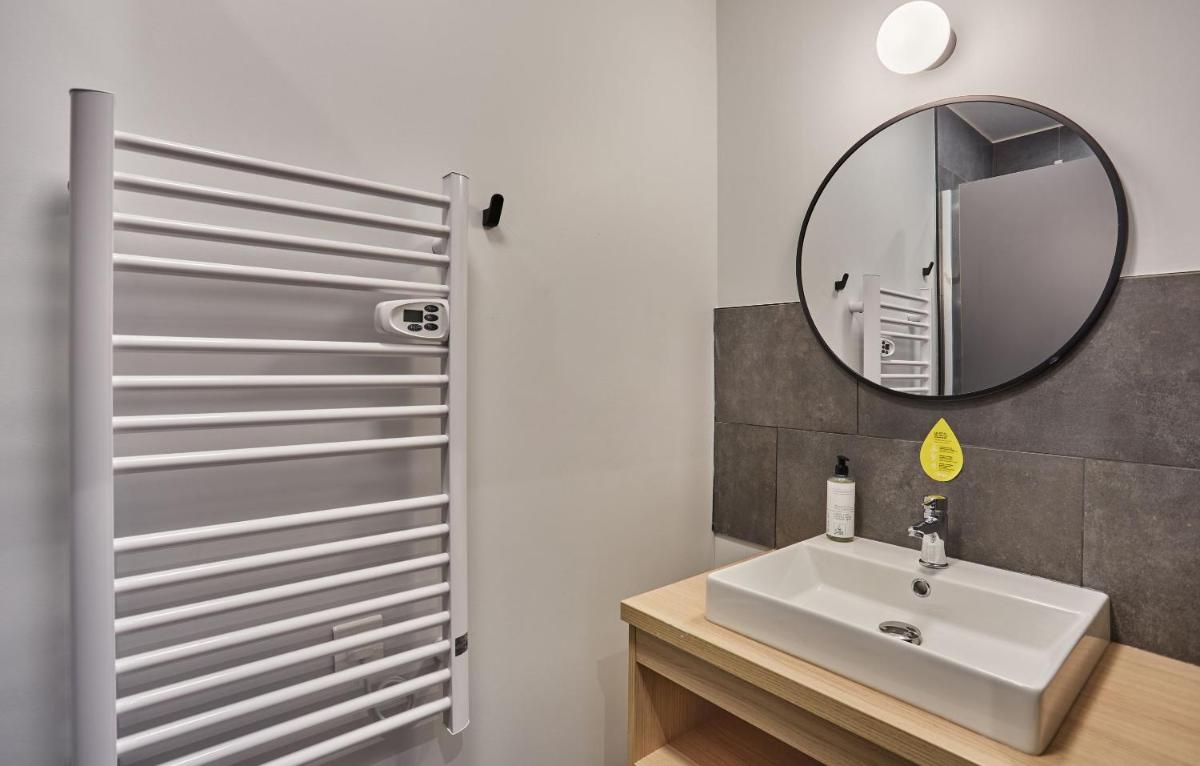 Salle de bains dans l'établissement Appart'hôtel Odalys City - Nîmes Arènes - Palais des Congrès