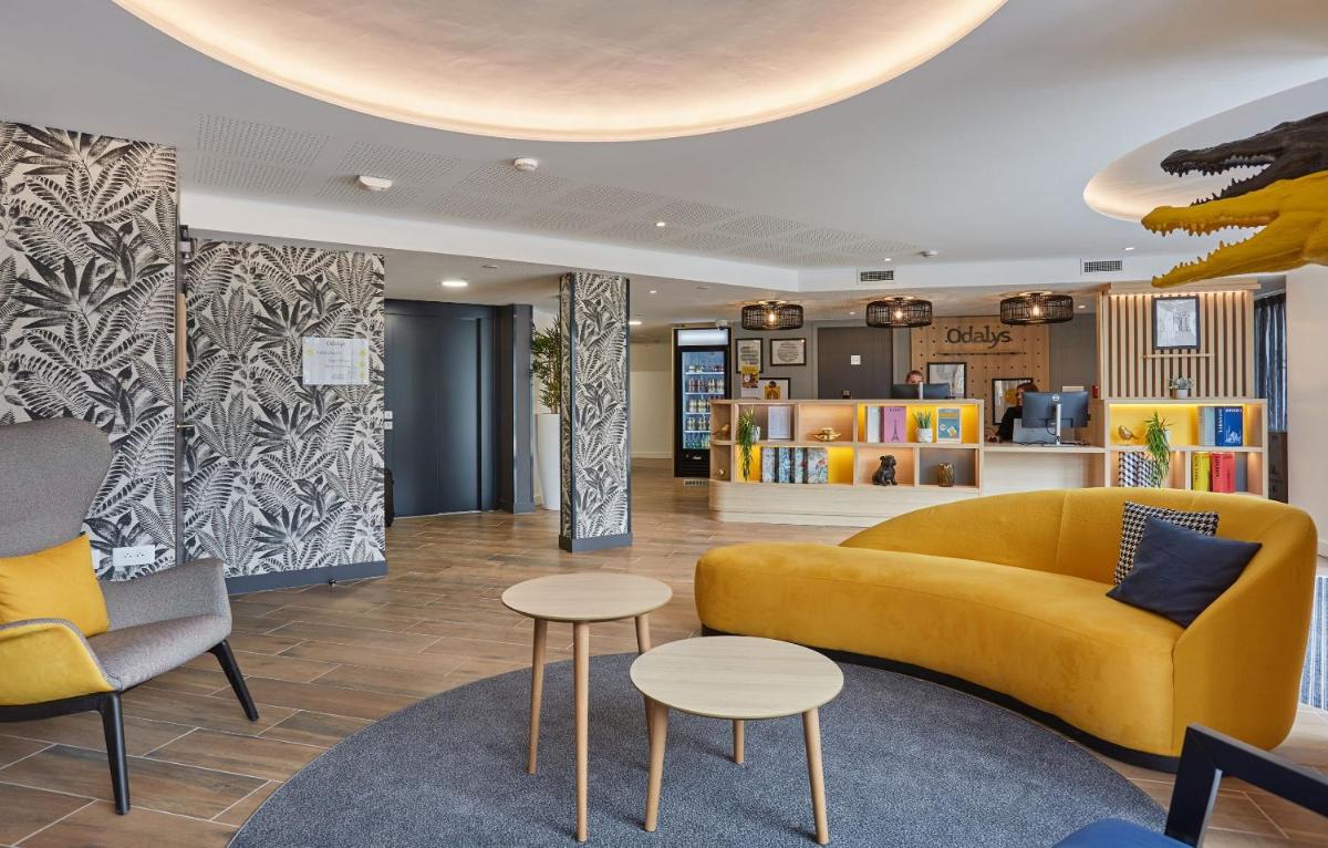 Coin salon dans l'établissement Appart'hôtel Odalys City - Nîmes Arènes - Palais des Congrès