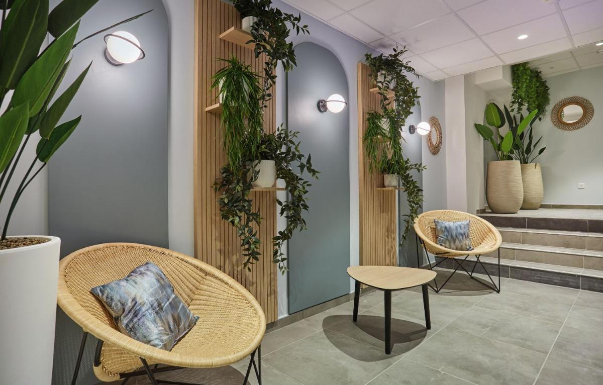 Coin salon dans l'établissement Appart'hôtel Odalys City - Nîmes Arènes - Palais des Congrès