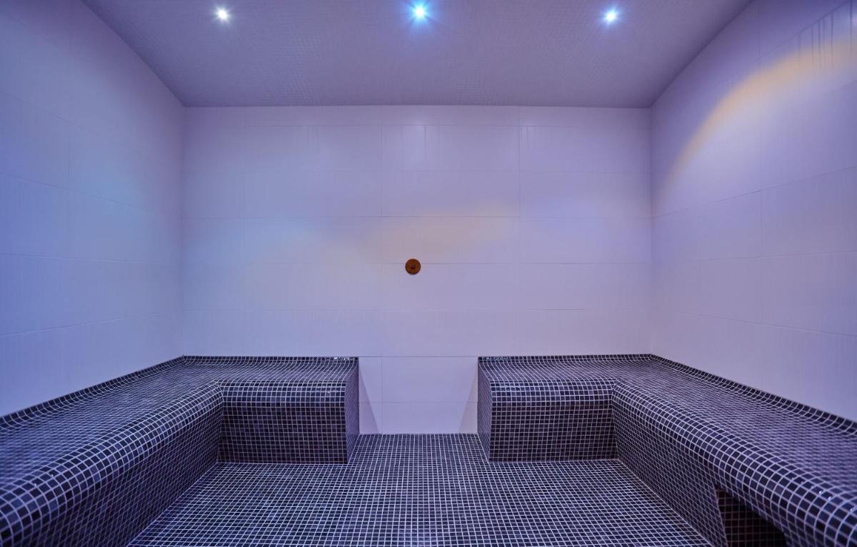 Coin salon dans l'établissement Appart'hôtel Odalys City - Nîmes Arènes - Palais des Congrès