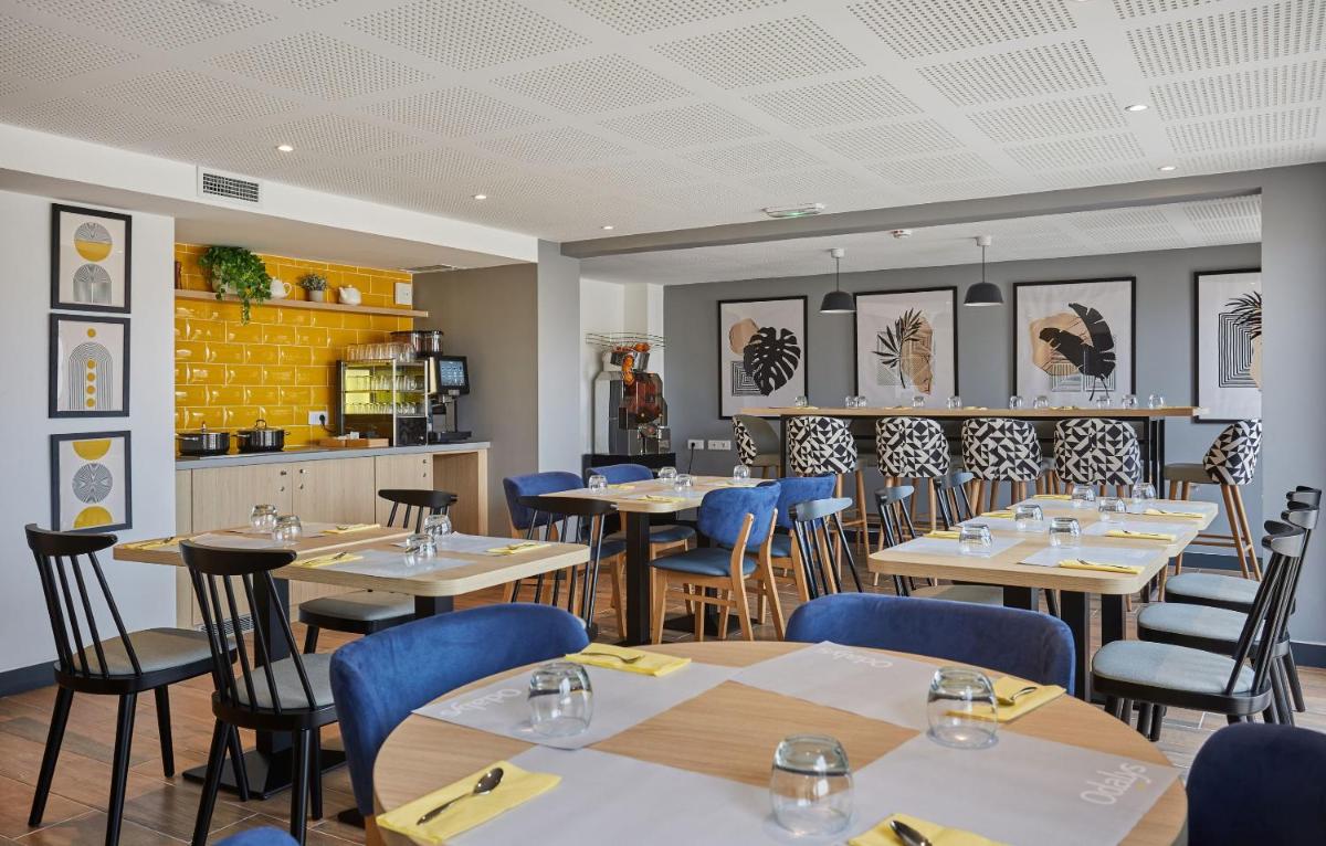 Restaurant ou autre lieu de restauration dans l'établissement Appart'hôtel Odalys City - Nîmes Arènes - Palais des Congrès