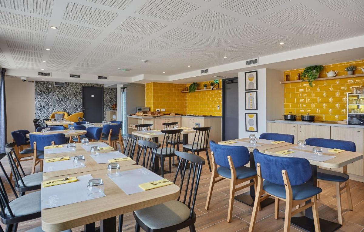 Restaurant ou autre lieu de restauration dans l'établissement Appart'hôtel Odalys City - Nîmes Arènes - Palais des Congrès