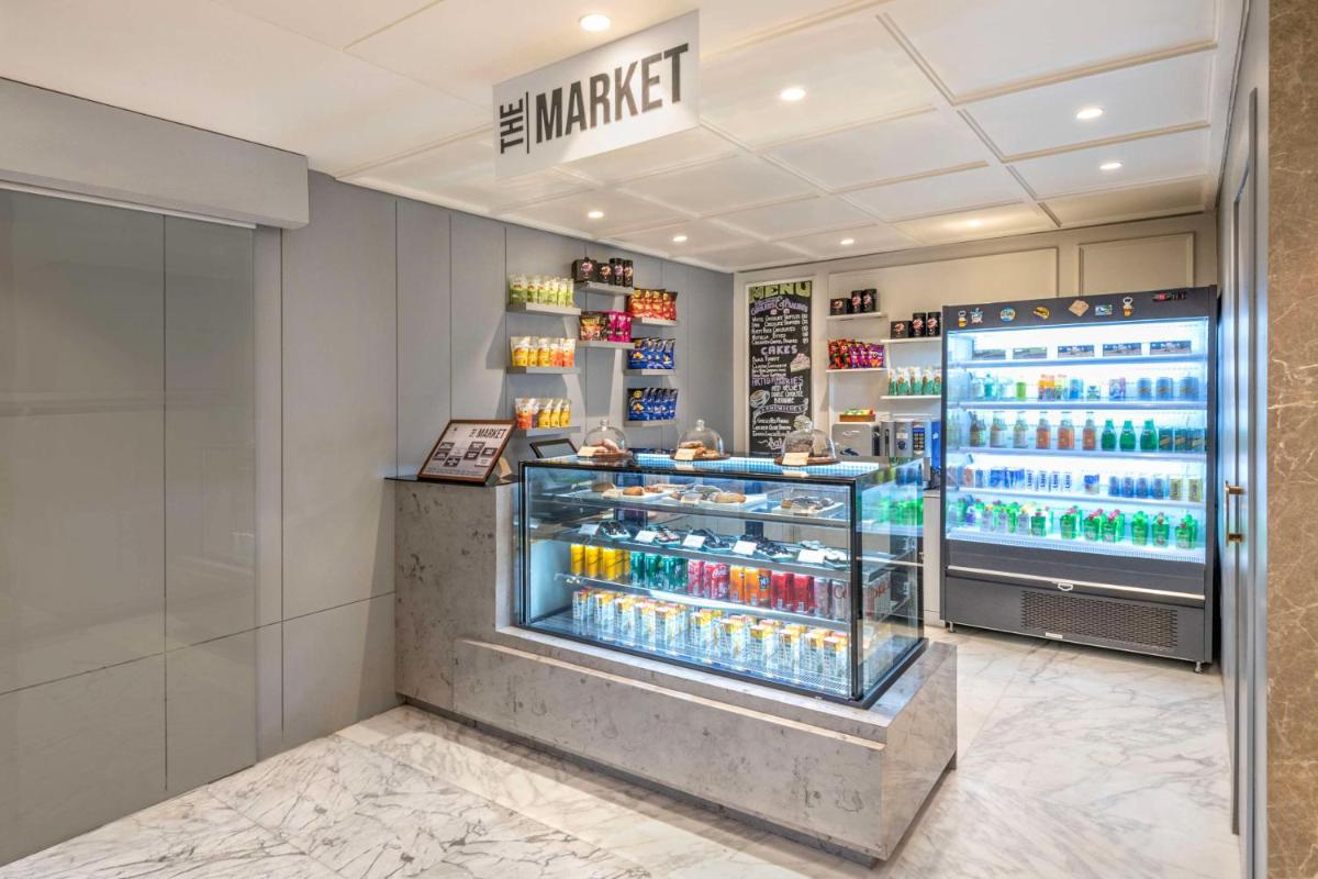 a store with a display case filled with drinks at Hyatt Place Goa Candolim in Candolim a store with a display case filled with drinks at Hyatt Place Goa Candolim in Candolim