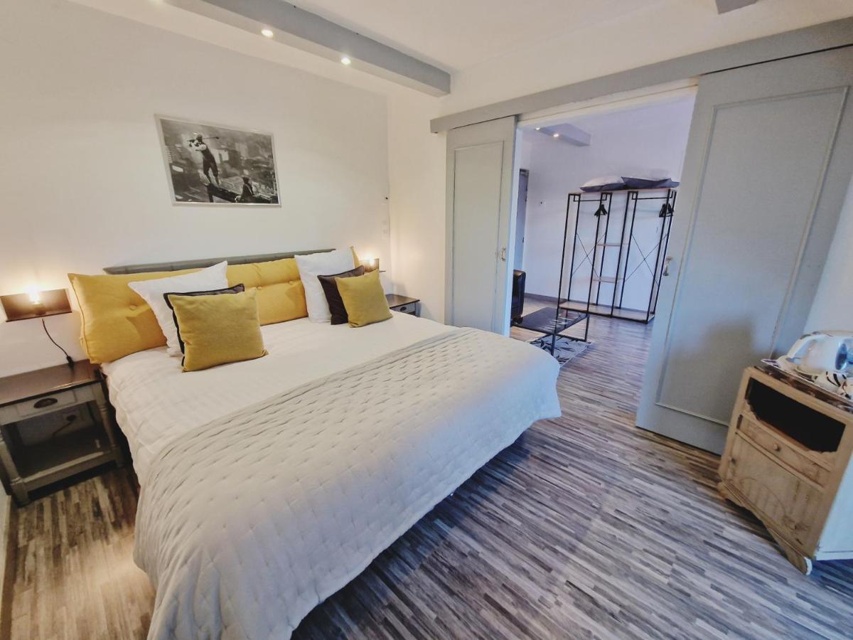 Un ou plusieurs lits dans un hébergement de l'établissement Les Terrasses de Saumur - Hôtel & Appartements - Restaurant & Spa (Logis)