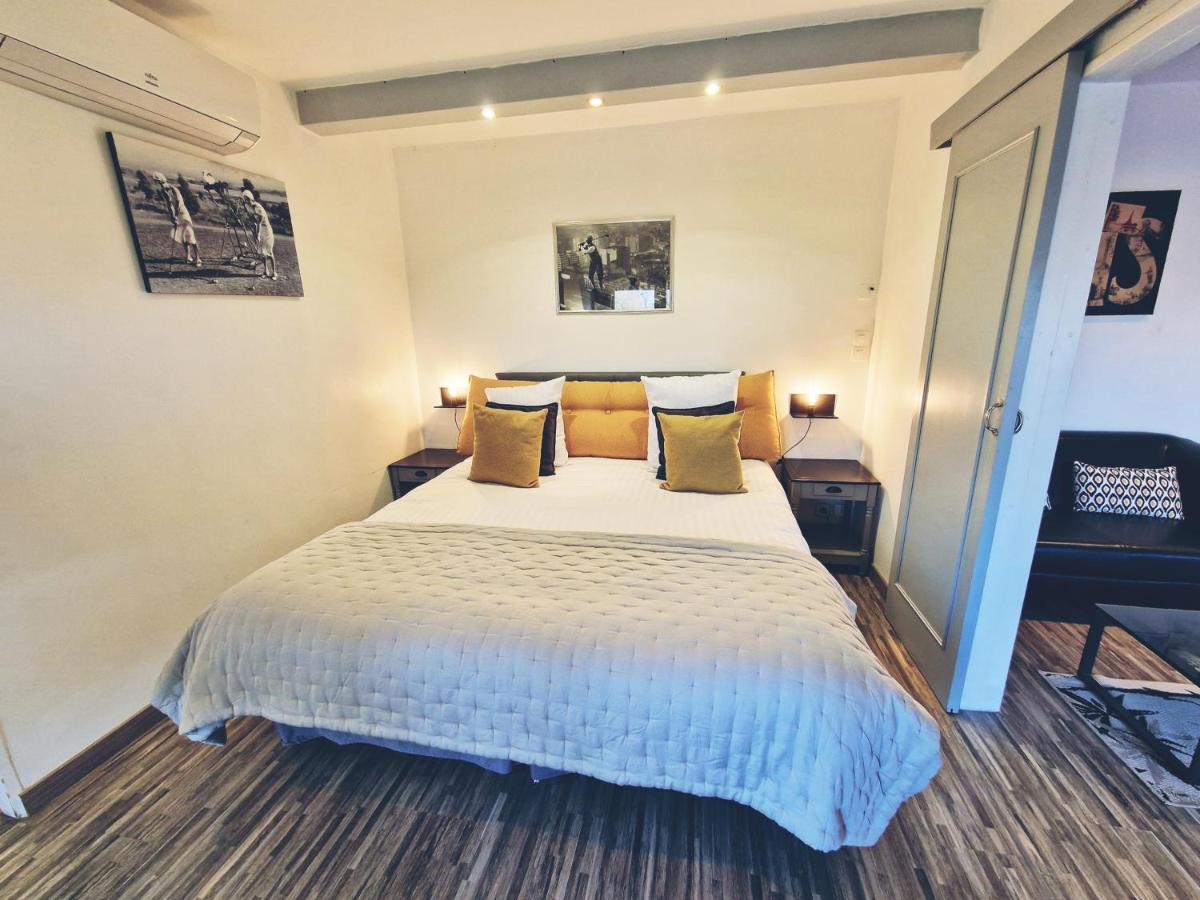 Un ou plusieurs lits dans un hébergement de l'établissement Les Terrasses de Saumur - Hôtel & Appartements - Restaurant & Spa (Logis)