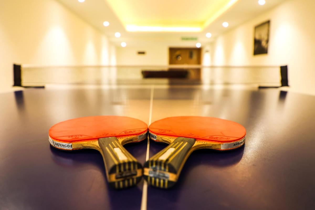 two pairs of tongs sitting on a bowling alley at Ramada Plaza by Wyndham Lucknow in Lucknow
