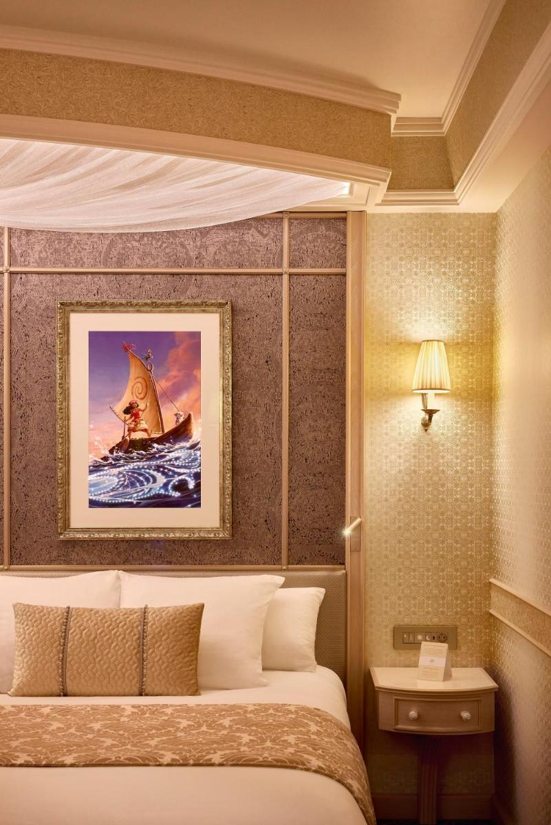 Un ou plusieurs lits dans un hébergement de l'établissement Disneyland® Hotel