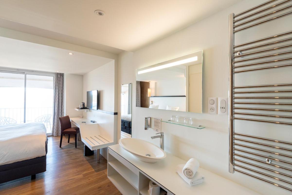 Un ou plusieurs lits dans un hébergement de l'établissement Côté Thalasso Hôtel & Spa Marin