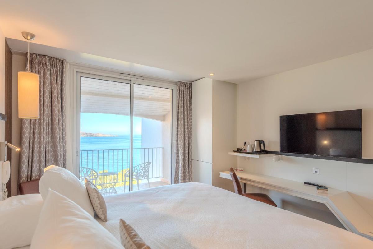 Un ou plusieurs lits dans un hébergement de l'établissement Côté Thalasso Hôtel & Spa Marin