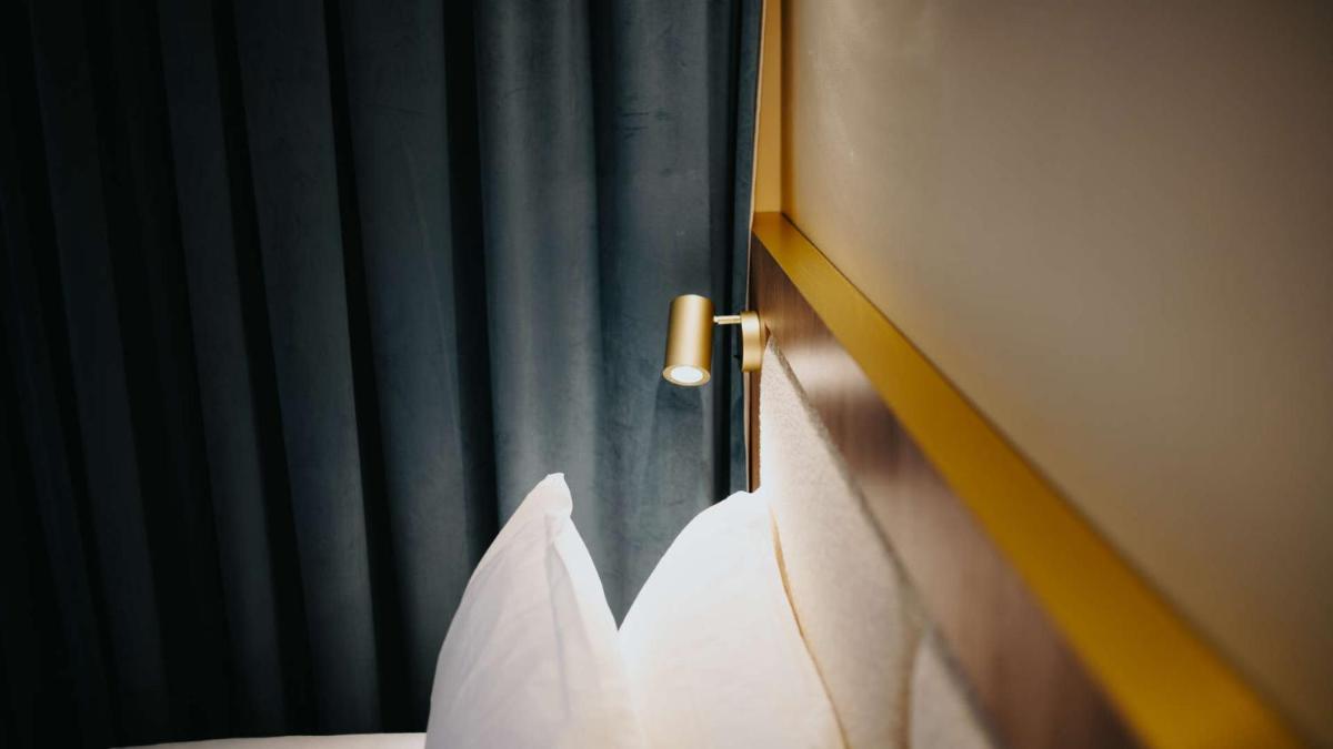 Un ou plusieurs lits dans un hébergement de l'établissement Keystone Hôtel & Spa