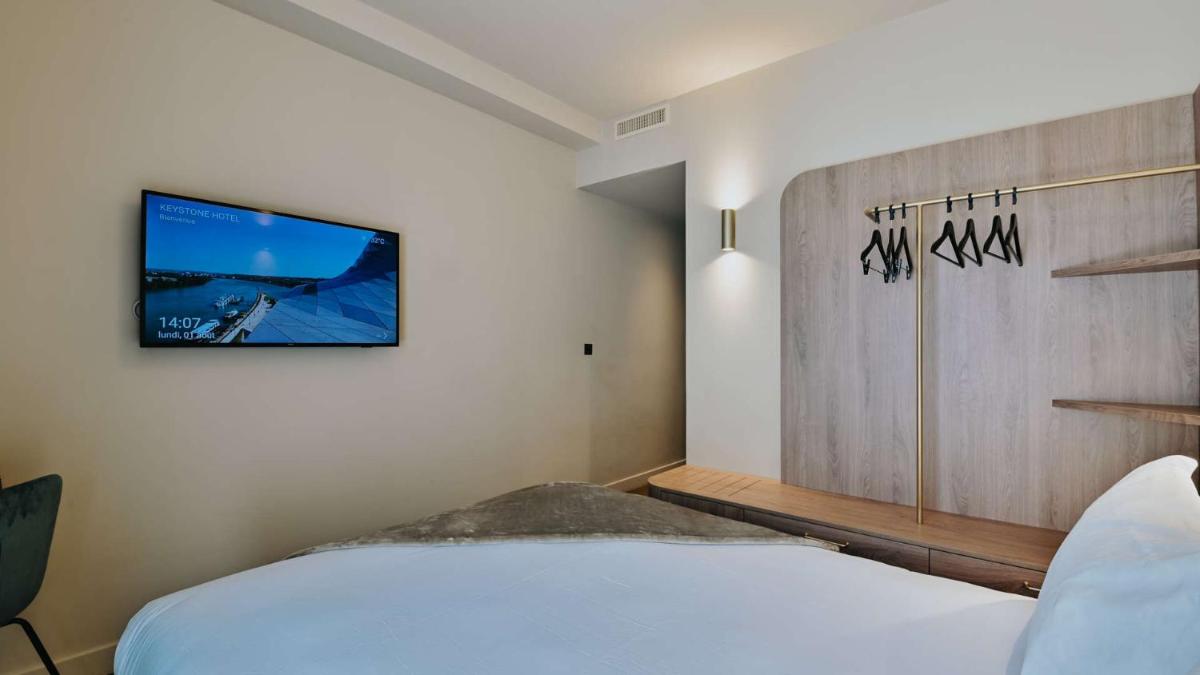 Un ou plusieurs lits dans un hébergement de l'établissement Keystone Hôtel & Spa