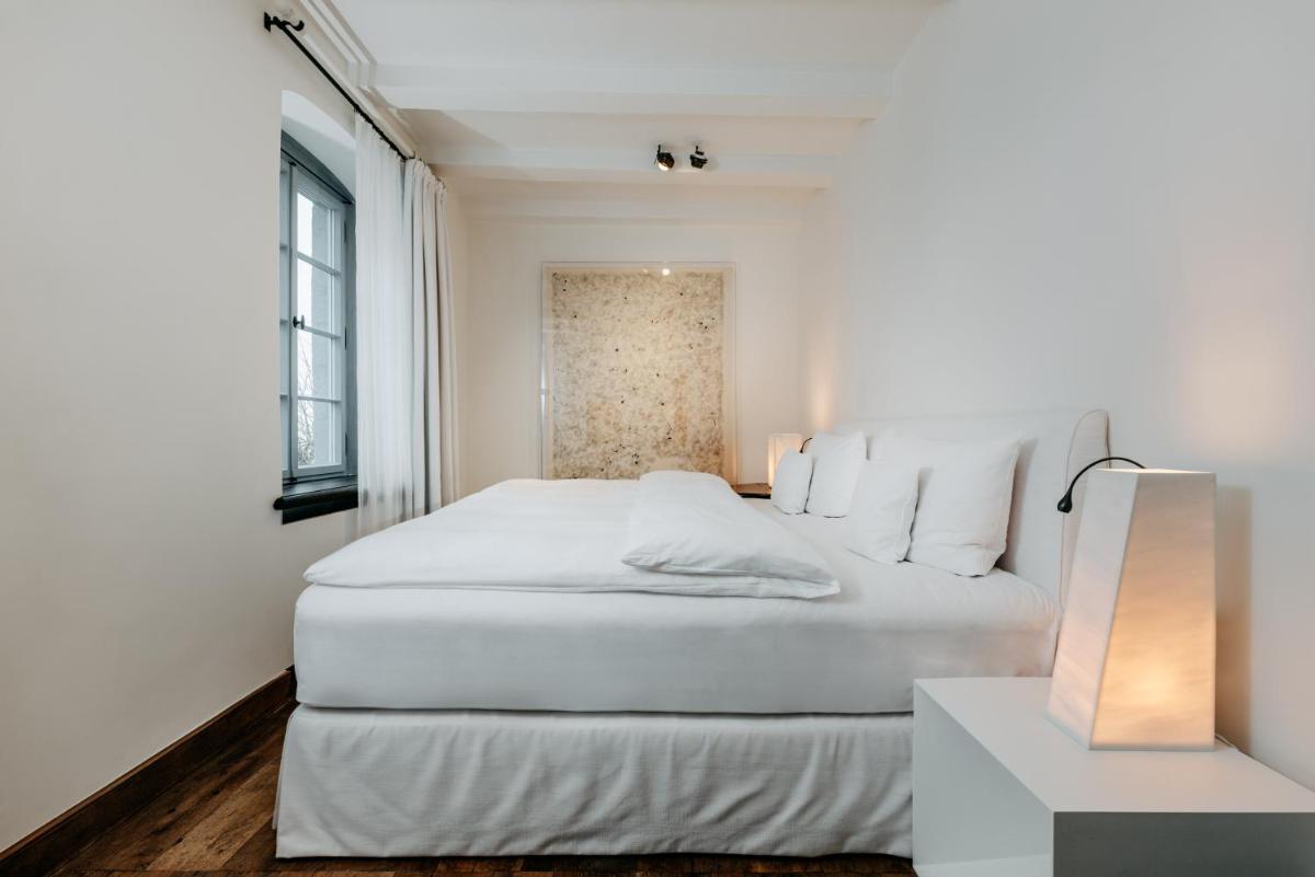 Ein Bett oder Betten in einem Zimmer der Unterkunft Hotel PURS