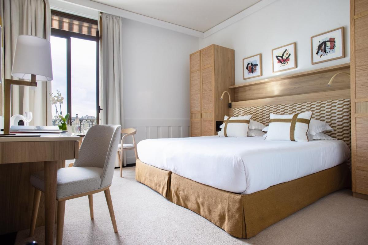 Un ou plusieurs lits dans un hébergement de l'établissement Hotel Royal-Riviera