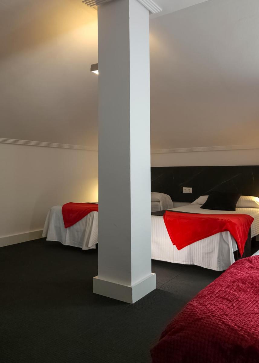 Cama o camas de una habitación en Hotel Spa El Muelle de Suances