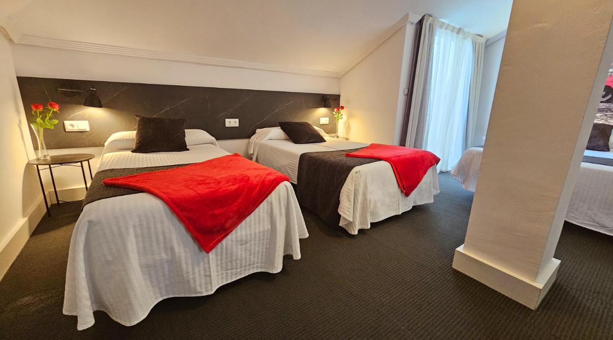 Cama o camas de una habitación en Hotel Spa El Muelle de Suances