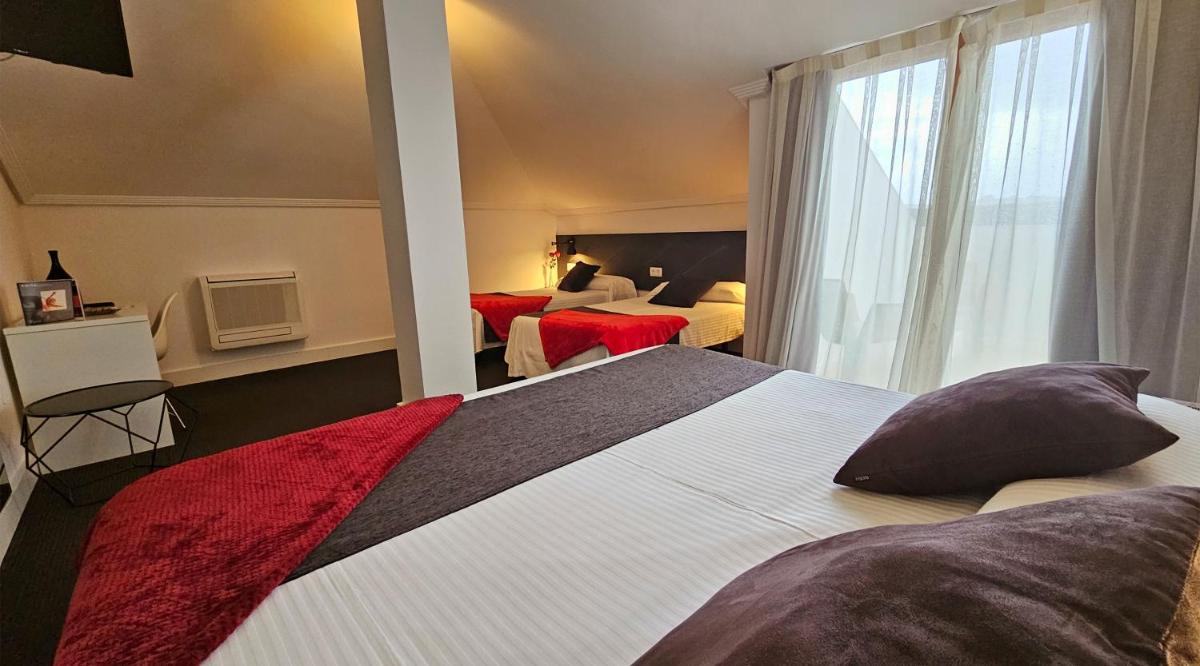 Cama o camas de una habitación en Hotel Spa El Muelle de Suances