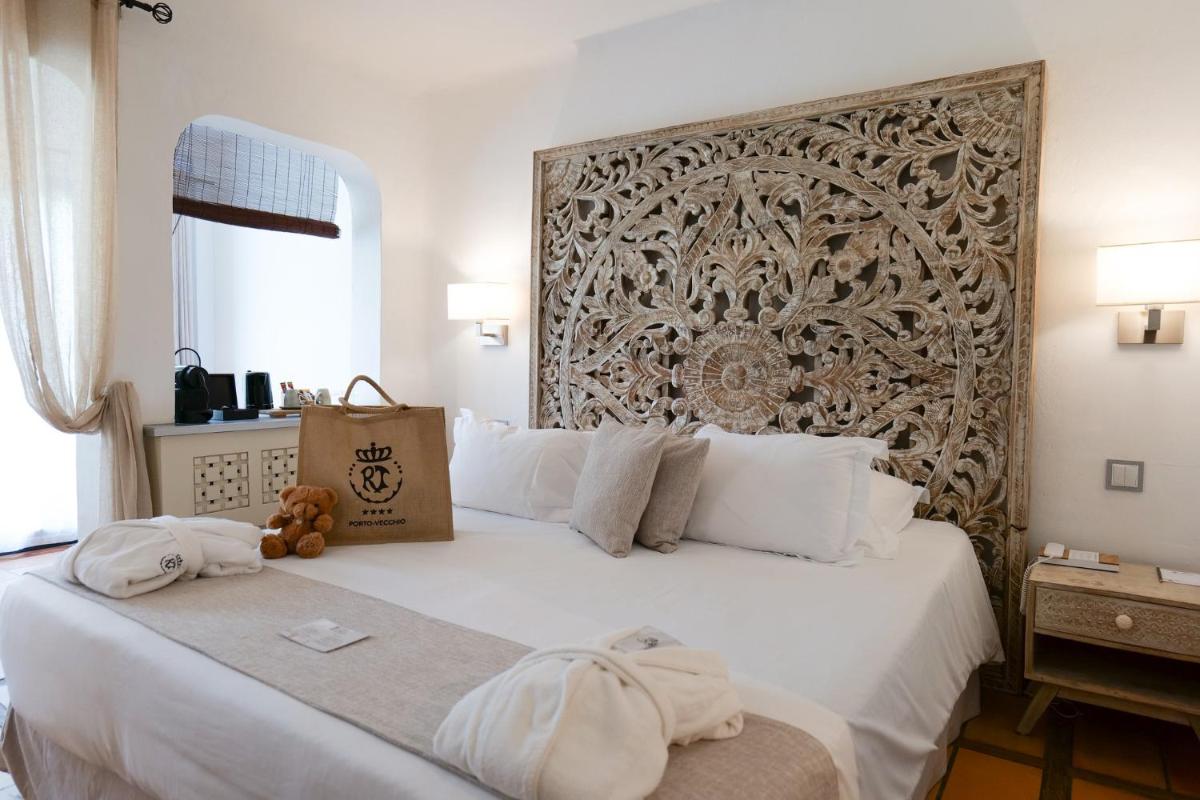 Un ou plusieurs lits dans un hébergement de l'établissement Hôtel Le Roi Théodore & Spa