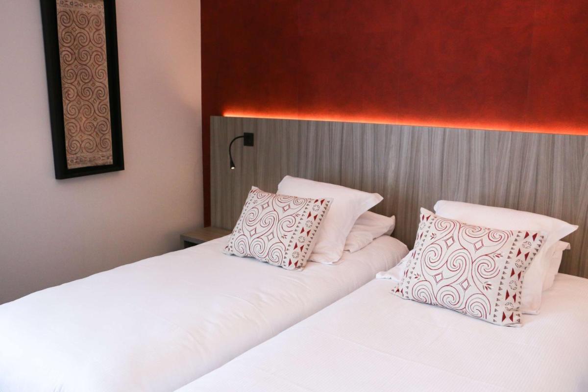 Un ou plusieurs lits dans un hébergement de l'établissement Best Western Plus Hôtel & Spa de Chassieu