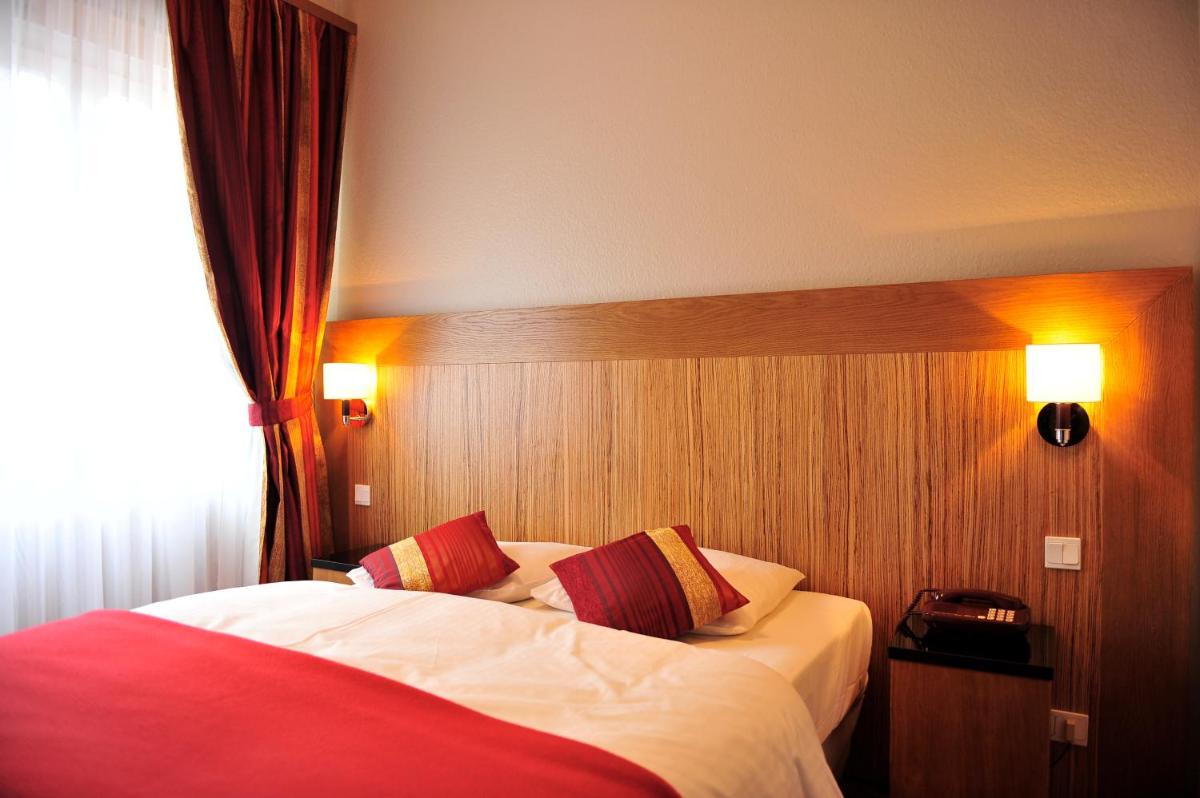 Un ou plusieurs lits dans un hébergement de l'établissement Hôtel du Parc, Restaurant, Spa & Wellness