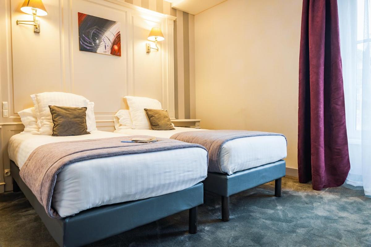 Un ou plusieurs lits dans un hébergement de l'établissement Grand Hôtel du Luxembourg & Spa