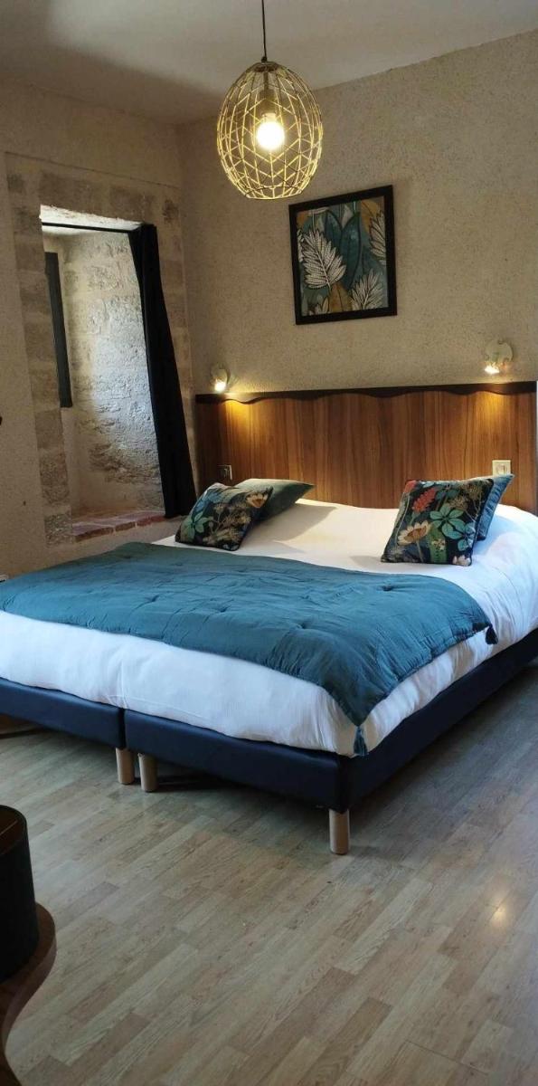 Un ou plusieurs lits dans un hébergement de l'établissement Hôtel Spa La Truite Dorée