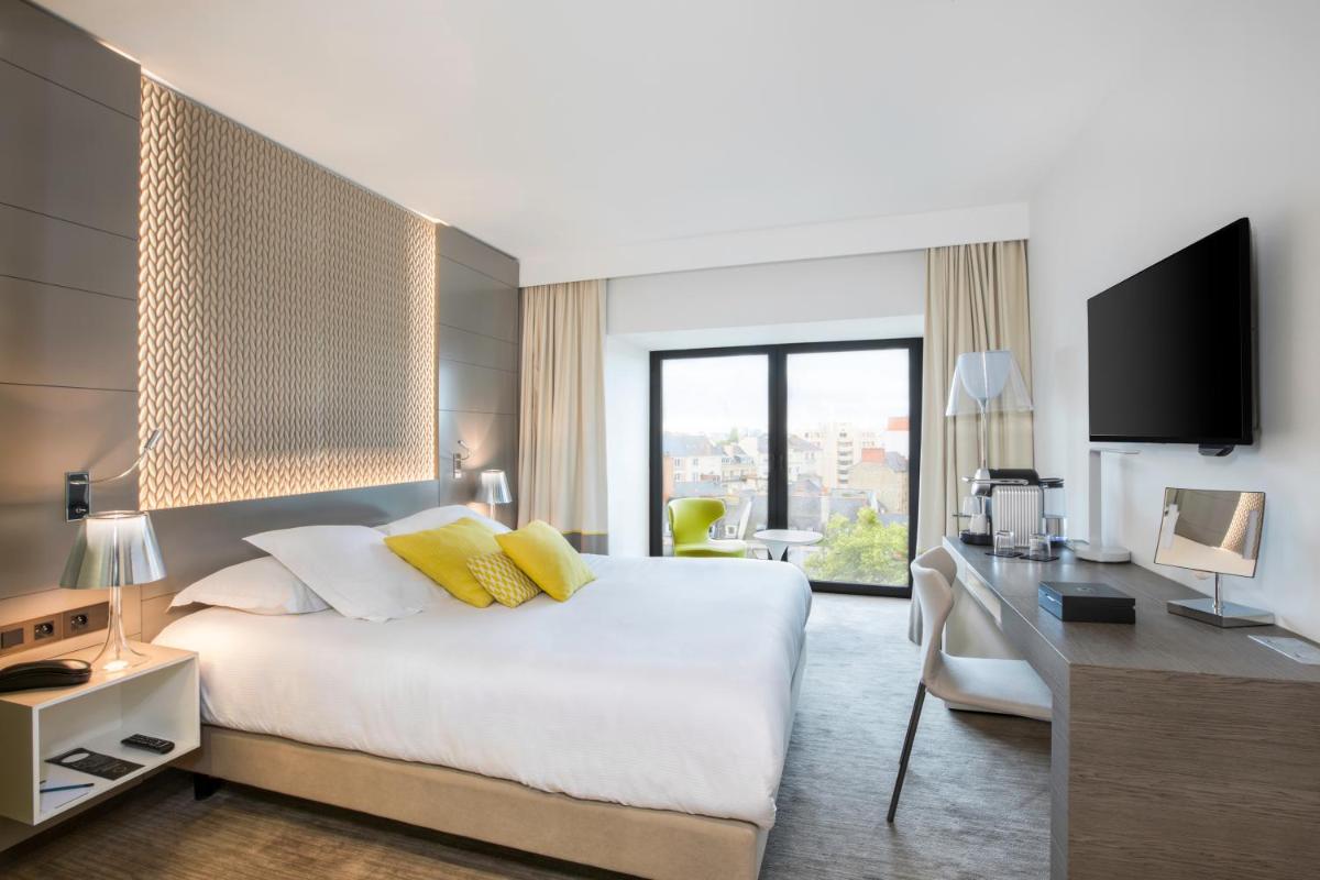 Un ou plusieurs lits dans un hébergement de l'établissement BW Premier Collection Le Saint Antoine Hotel et Spa