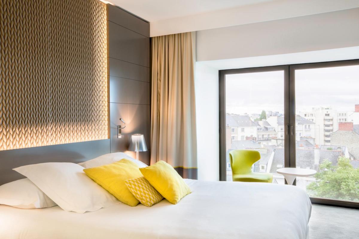 Un ou plusieurs lits dans un hébergement de l'établissement BW Premier Collection Le Saint Antoine Hotel et Spa
