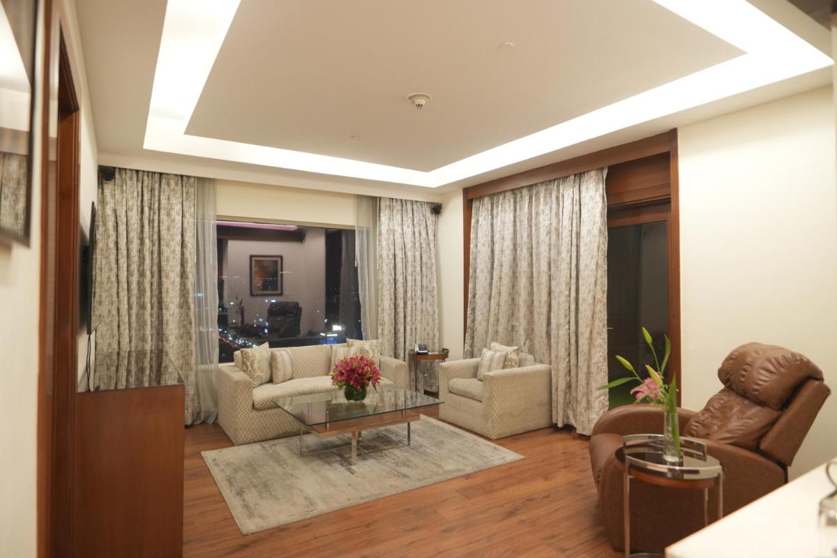 a living room with a couch and chairs and a table at DoubleTree by Hilton Gurgaon New Delhi NCR in Gurgaon