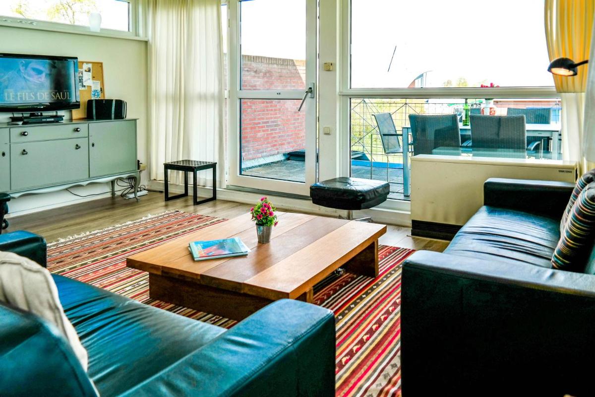 6pers. Modern house Iris with a view of the Lauwersmeer with 2 terraces - Housity