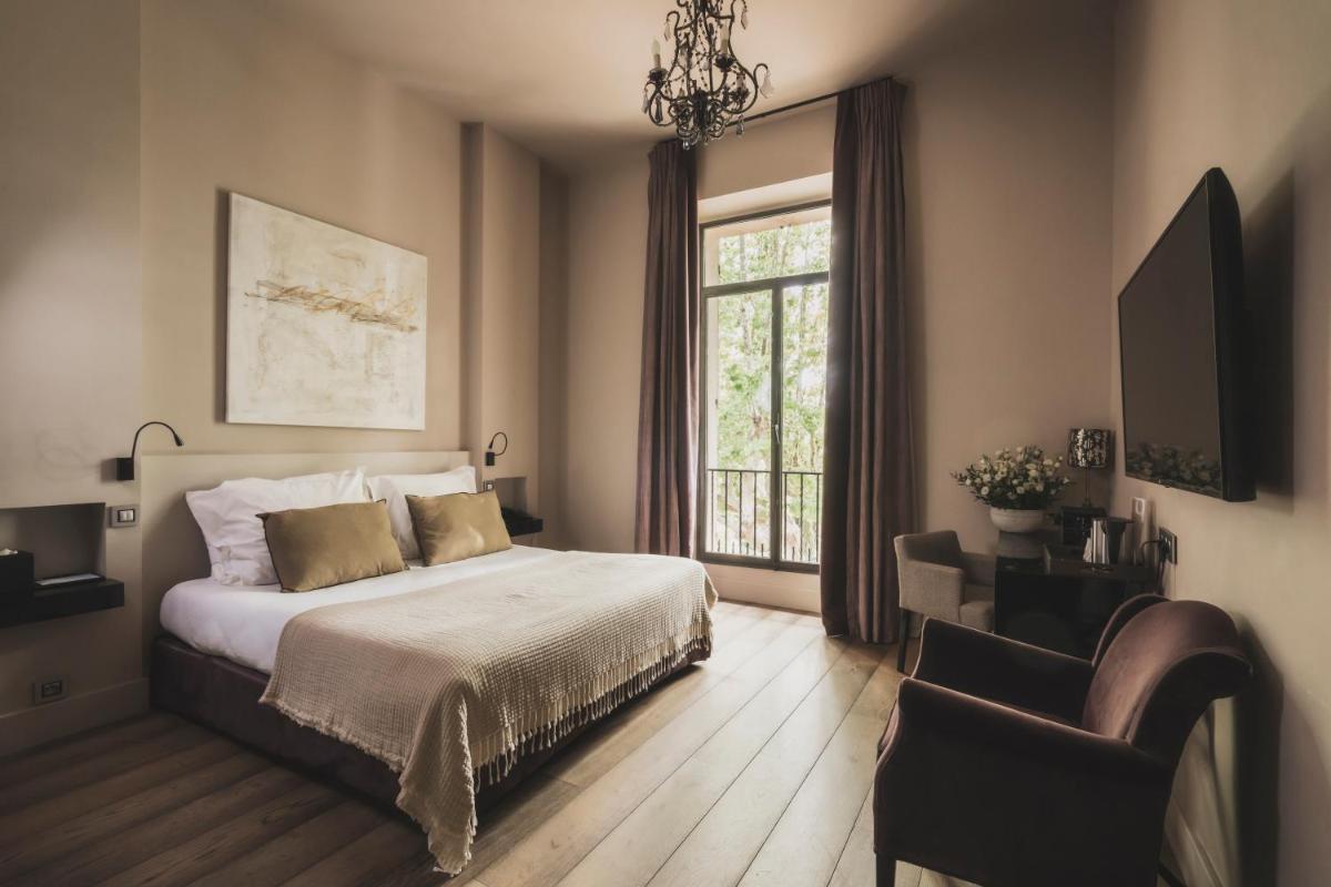 Un ou plusieurs lits dans un hébergement de l'établissement Les Lodges Sainte-Victoire Hotel & Spa