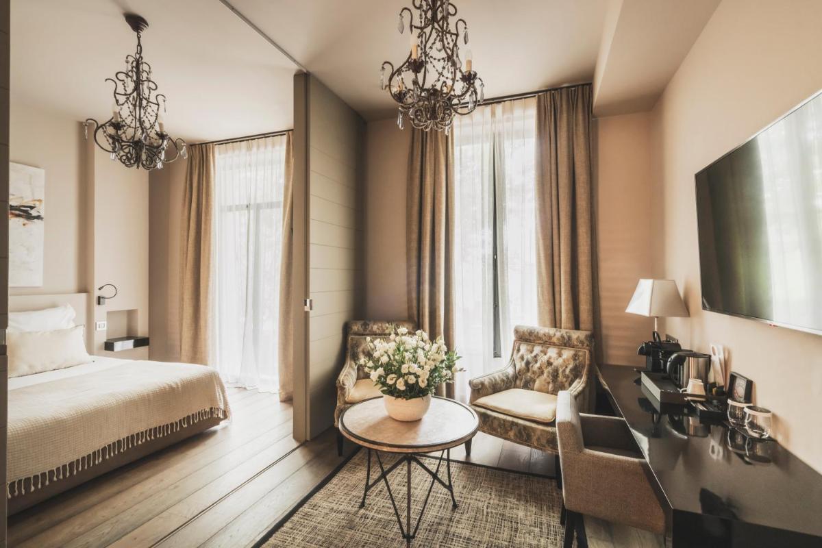 Un ou plusieurs lits dans un hébergement de l'établissement Les Lodges Sainte-Victoire Hotel & Spa