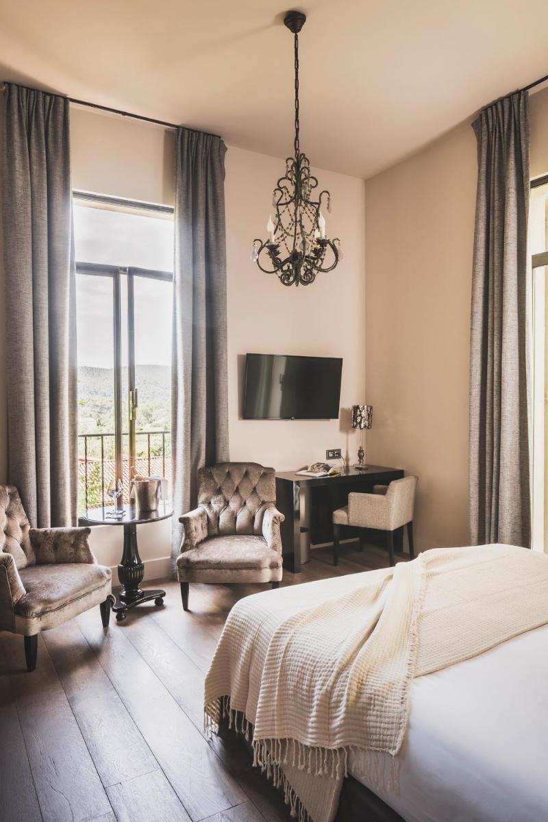 Un ou plusieurs lits dans un hébergement de l'établissement Les Lodges Sainte-Victoire Hotel & Spa