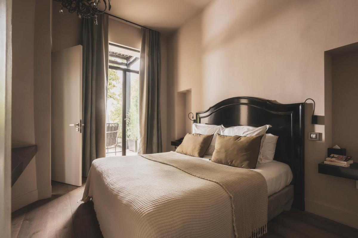 Un ou plusieurs lits dans un hébergement de l'établissement Les Lodges Sainte-Victoire Hotel & Spa