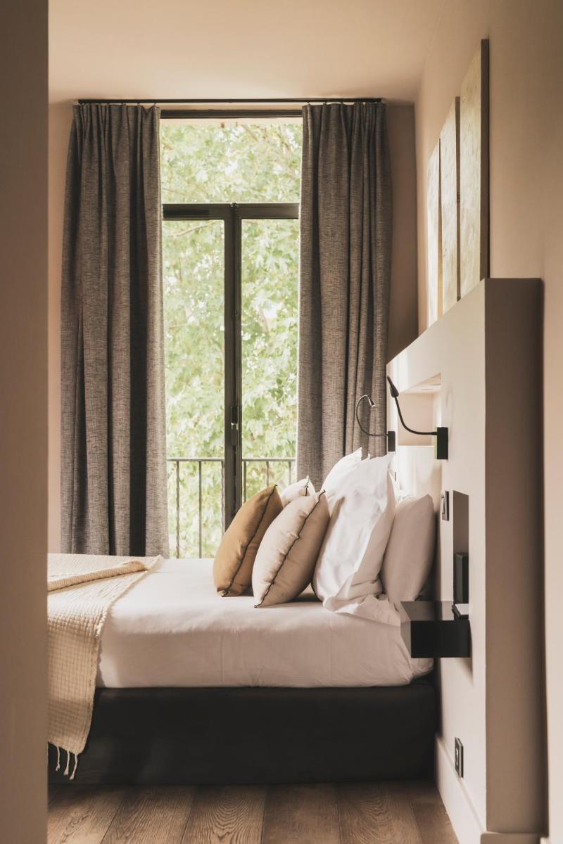 Un ou plusieurs lits dans un hébergement de l'établissement Les Lodges Sainte-Victoire Hotel & Spa