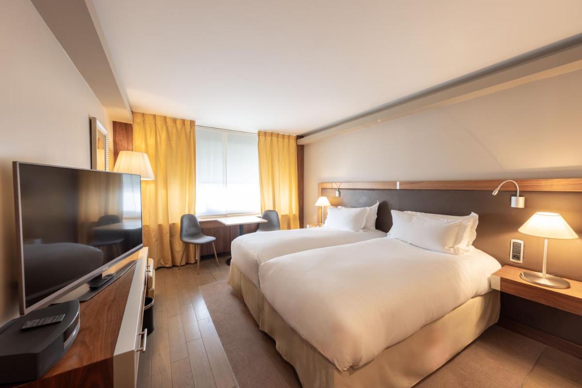 Un ou plusieurs lits dans un hébergement de l'établissement Sofitel Lyon Bellecour
