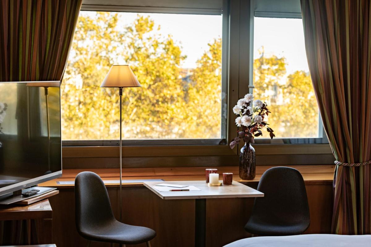 Télévision ou salle de divertissement dans l'établissement Sofitel Lyon Bellecour