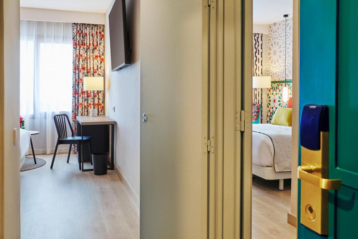 Cama o camas de una habitación en Hesperia Sevilla