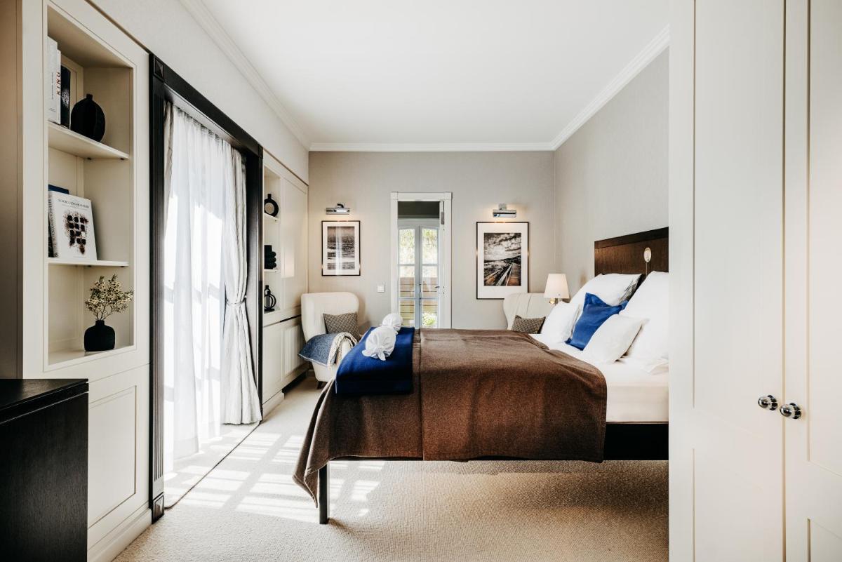 Ein Bett oder Betten in einem Zimmer der Unterkunft Söl'ring Hof