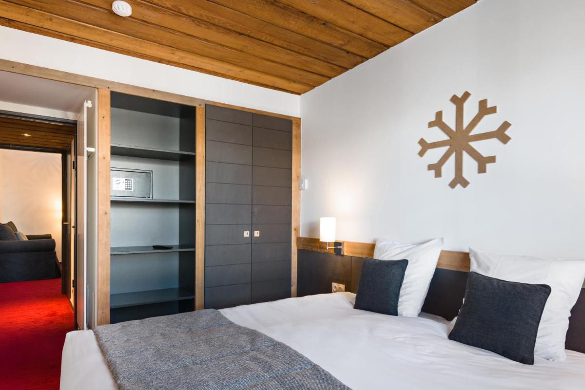 Un ou plusieurs lits dans un hébergement de l'établissement Marmotel & Spa