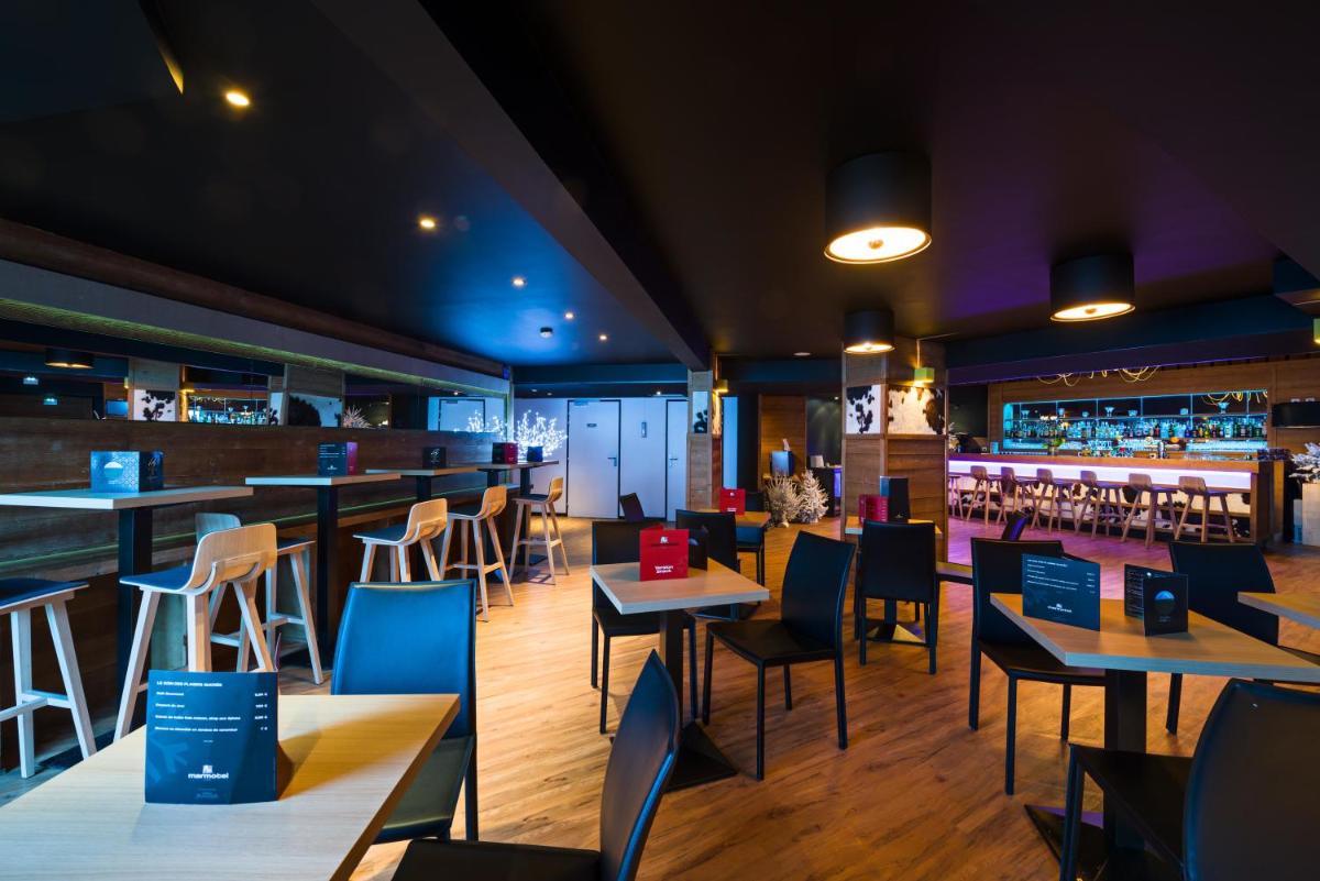 Restaurant ou autre lieu de restauration dans l'établissement Marmotel & Spa