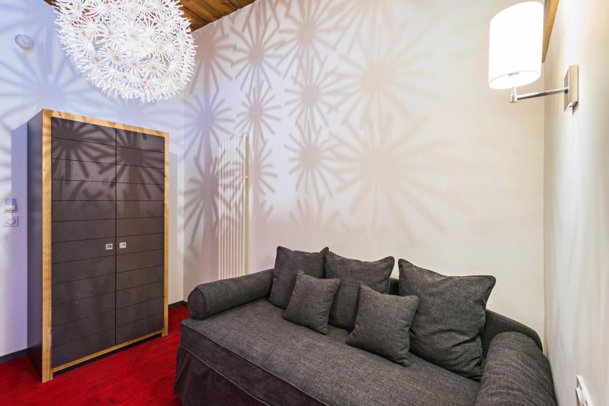 Coin salon dans l'établissement Marmotel & Spa
