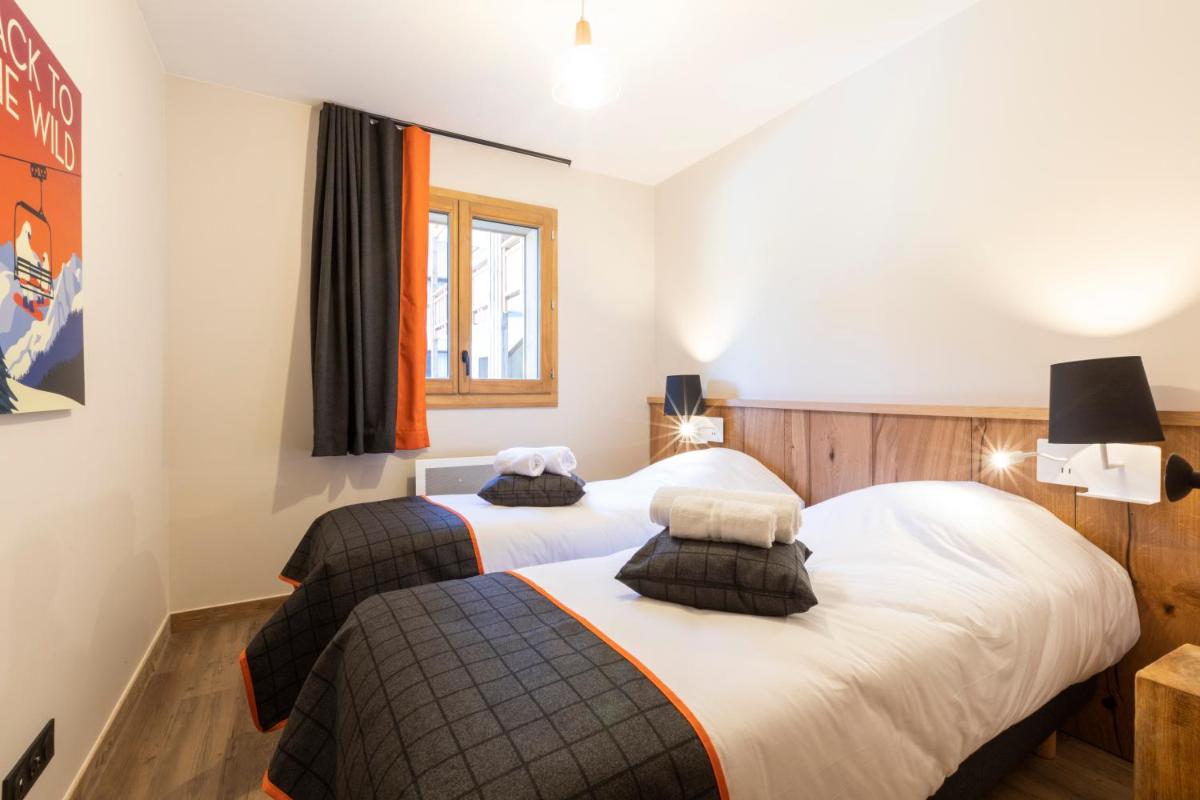 Un ou plusieurs lits dans un hébergement de l'établissement Résidence Club MMV Samoens