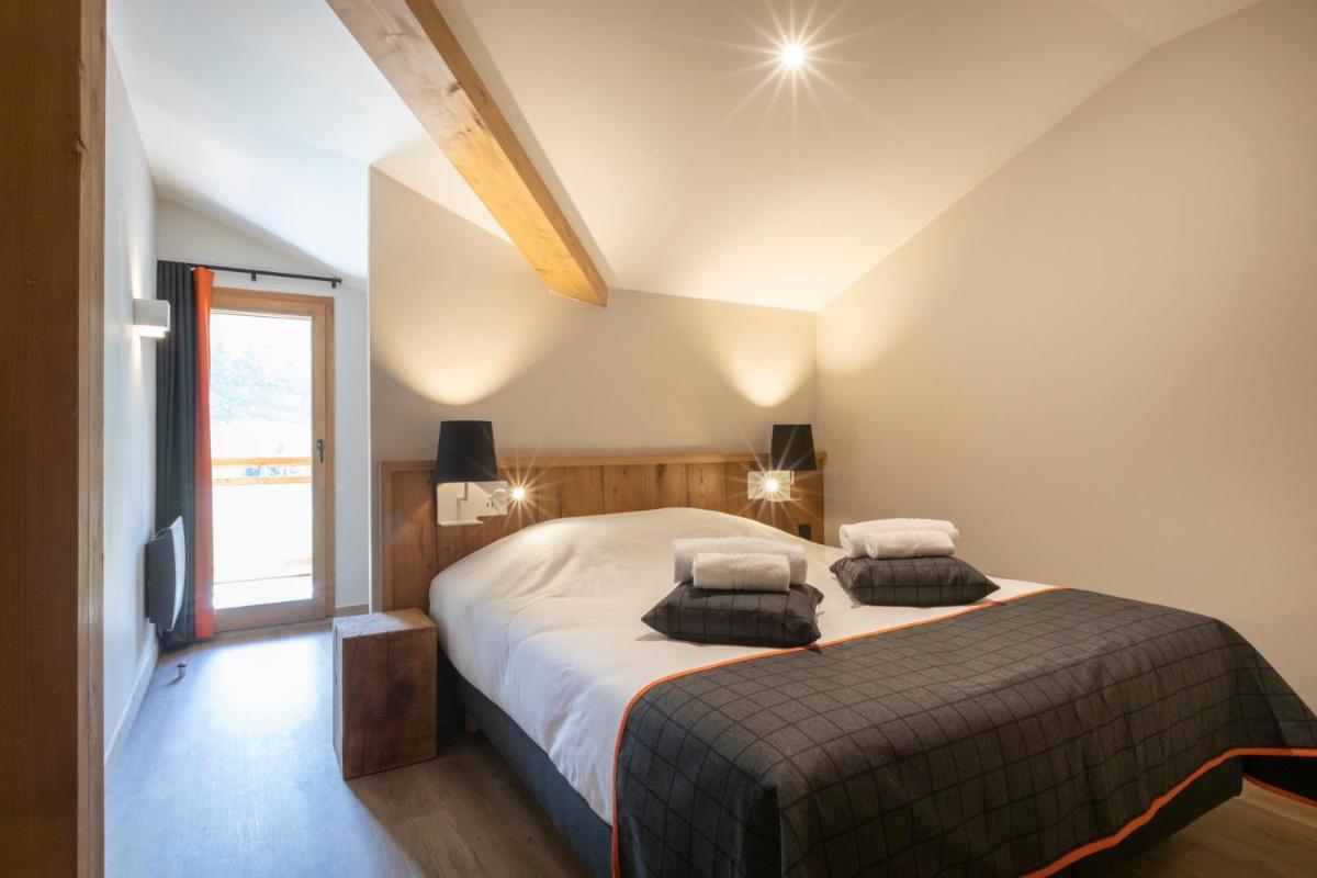 Un ou plusieurs lits dans un hébergement de l'établissement Résidence Club MMV Samoens
