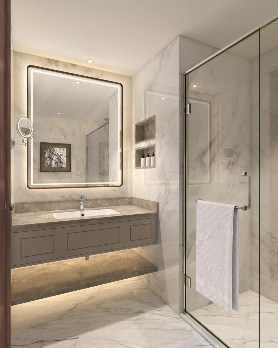 a bathroom with a sink and a mirror at Doubletree By Hilton Bengaluru Whitefield in Bengaluru