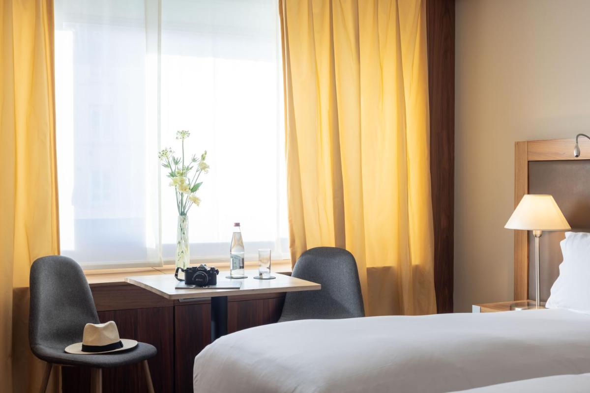 Un ou plusieurs lits dans un hébergement de l'établissement Sofitel Lyon Bellecour