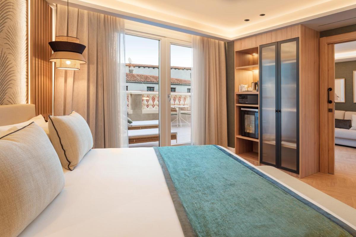 Cama o camas de una habitación en Catalonia Atocha