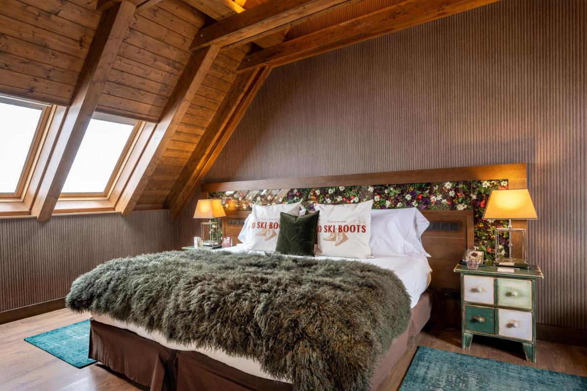 Cama o camas de una habitación en Hotel Val de Neu G.L.